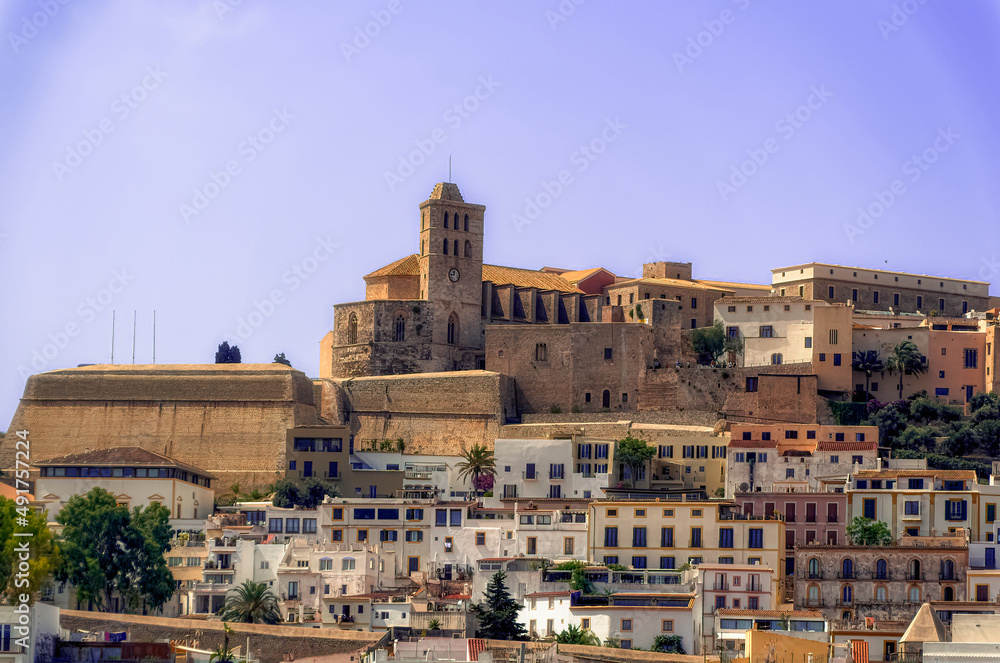 A sea side view to the Ibiza Old Town with Cathedral of Santa Maria d`Eivissa at the top of the hill in Ibiza, Spain.