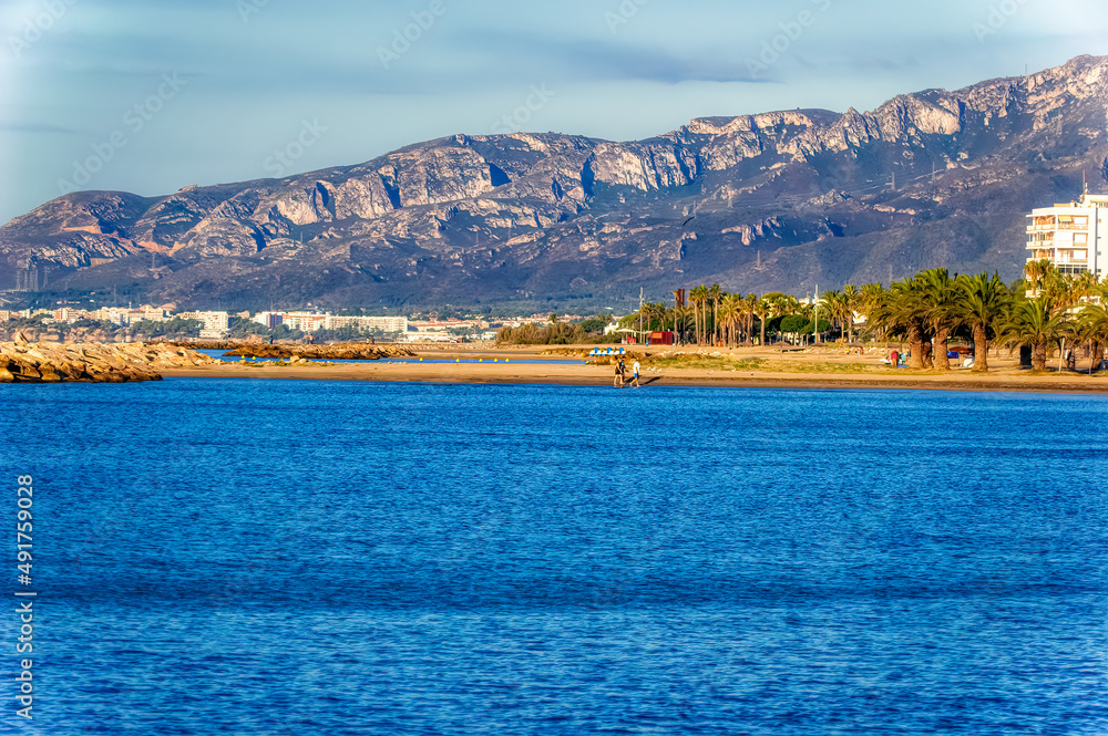 View to the beach during hot summer day in Cambrils, Spain.