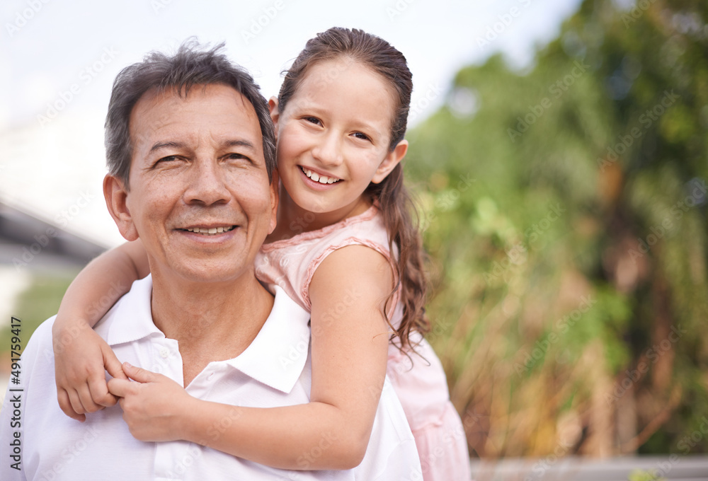 Enjoying time with granddad. Portrait of a young girl and her grandfather spending time together. Enjoying time with granddad. Portrait of a young girl and her grandfather spending time together.