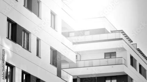 Fragment of modern residential apartment with flat buildings exterior. Detail of new luxury house and home complex. Black and white filter.