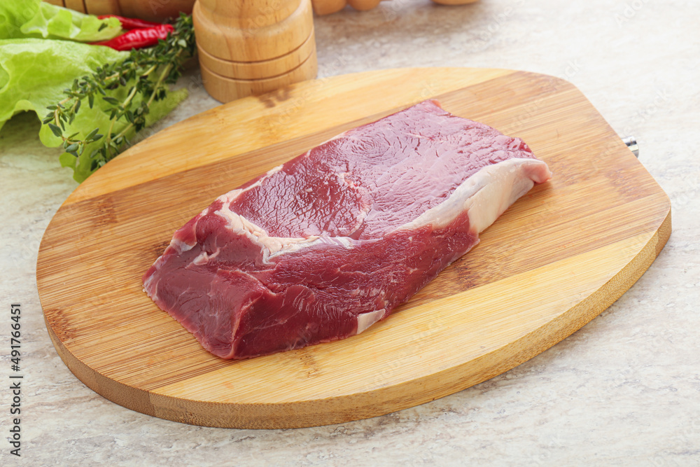 Raw rib-eye beef steak black angus