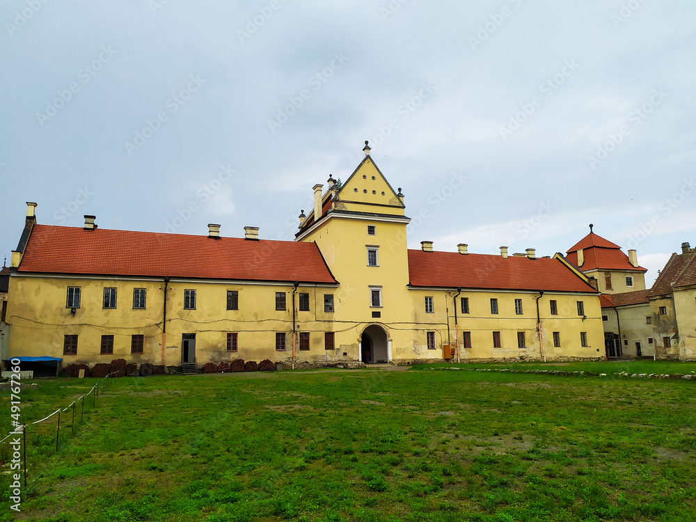 Zhovkva Castle is an architectural monument of the Renaissance in the city of Zhovkva in Lviv region of Ukraine. view of the main gate to renaissance castle on cloudy summer day