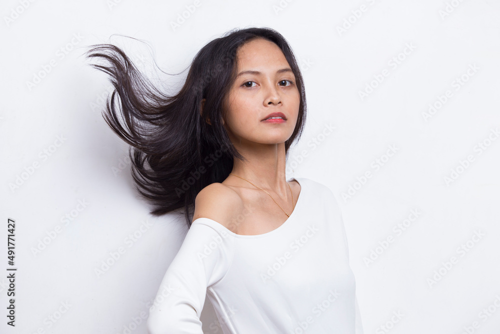 portrait of beautiful young asian woman with clean and fresh hair isolated on white background
portrait of beautiful young asian woman with clean and fresh hair isolated on white background