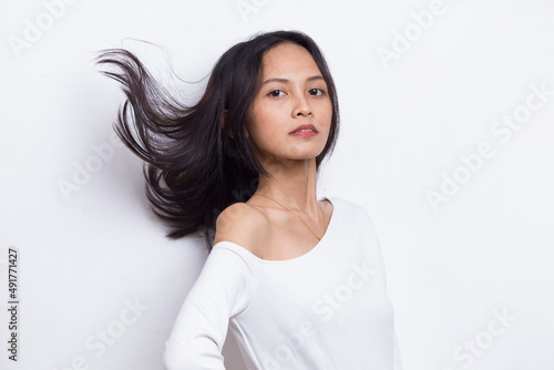 portrait of beautiful young asian woman with clean and fresh hair isolated on white background 