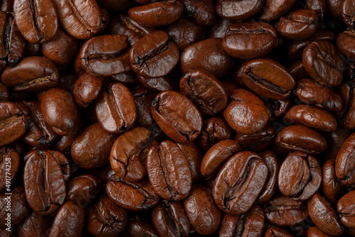 Fototapeta Naklejka Na Ścianę i Meble -  Macro shot of roasted coffee beans texture.