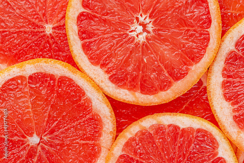 Fotografia Red grapefruit background. Top view, close up.