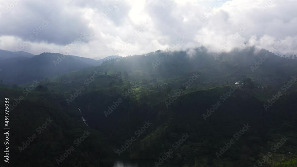 Tropical landscape with Tea estate among the mountains. Tea plantations. Tropical landscape with Tea estate among the mountains. Tea plantations.