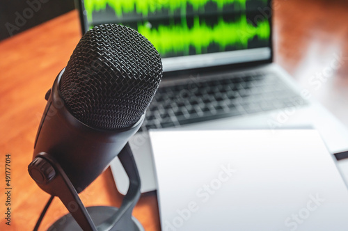 Microphone and wave form on the screen and blank sheet
