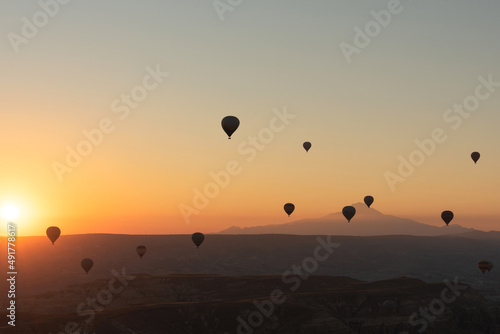 Hot air balloons in the sky during sunrise. Travel, dreams come true concept