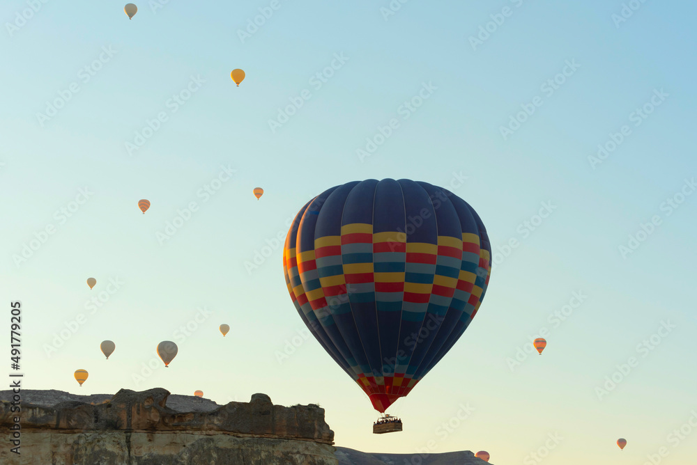 Fototapeta premium Hot air balloons in the sky during sunrise. Travel, dreams come true concept