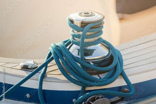 Fotografija Part of the boat with a chrome element for mooring and the actual rope