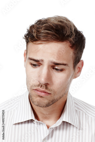 Why so glum, chum. Cropped studio shot of a broody young man isolated on white.