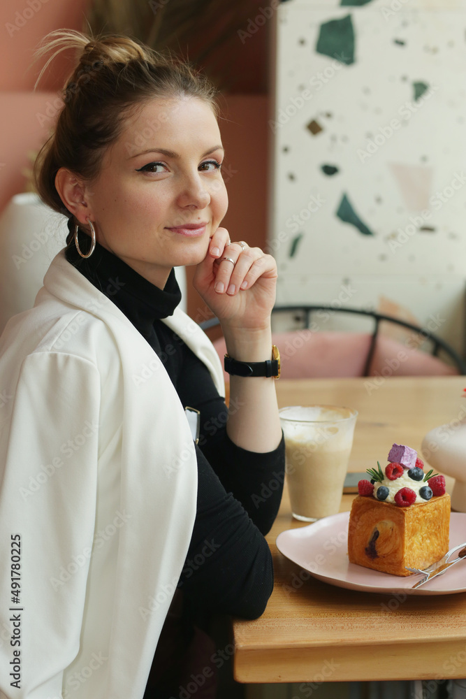 young blond business woman on lunch in cafe drinking latte coffee close up photo young blond business woman on lunch in cafe drinking latte coffee close up photo
