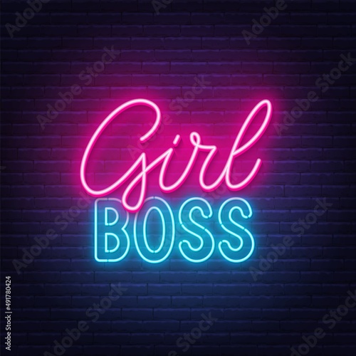Girl Boss neon quote on a brick wall.