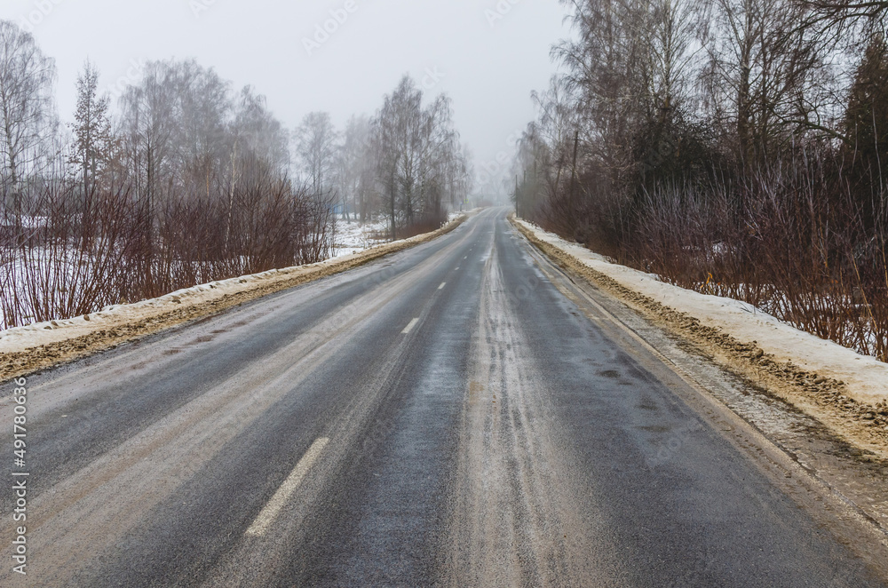 Winter asphalt road in the countryside in russia Winter asphalt road in the countryside in russia