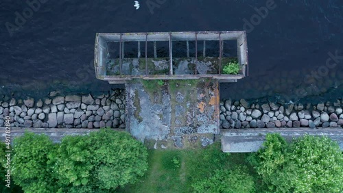 Cargo dock.Bird's-eye view of the fort Totleben Pervomaisky in the waters of the Gulf of Finland, wild island.Large artillery fire with concrete casemates and shell cellars. Kronstadt Fortress photo