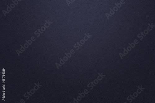 Dark blue wall with light on middle texture background