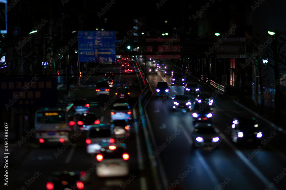 A night miniature traffic jam at the city street in Tokyo