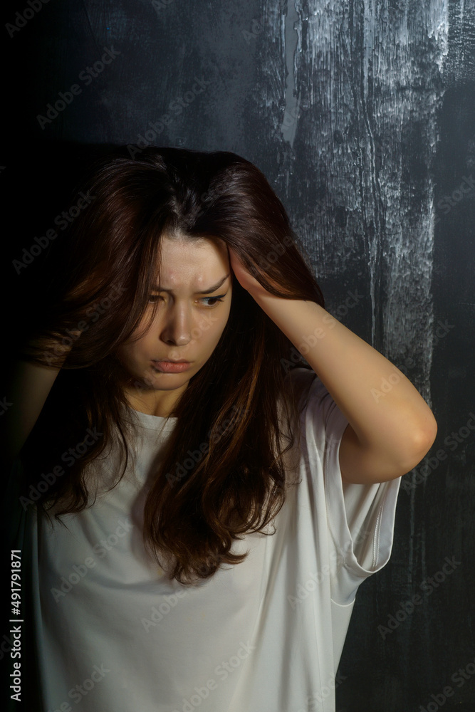 portrait of a young woman with emotions suffering, depression, pain, fear, loneliness, longing, mental disorders portrait of a young woman with emotions suffering, depression, pain, fear, loneliness, longing, mental disorders