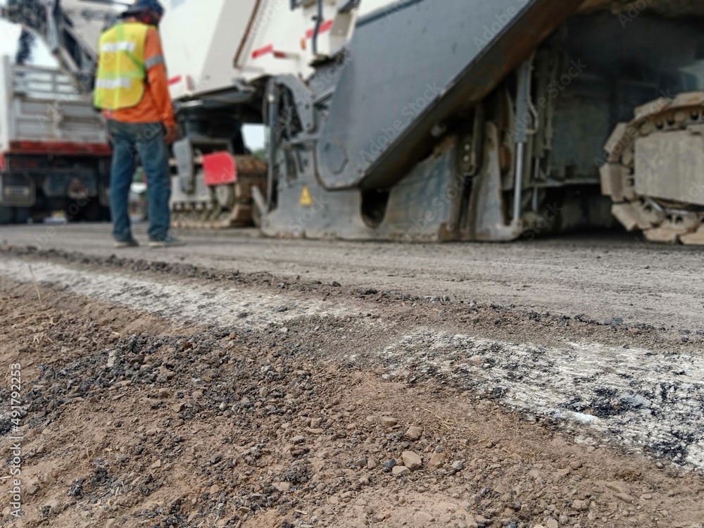 Blurred view of road construction with heavy machinery. Blurred view of road construction with heavy machinery.
