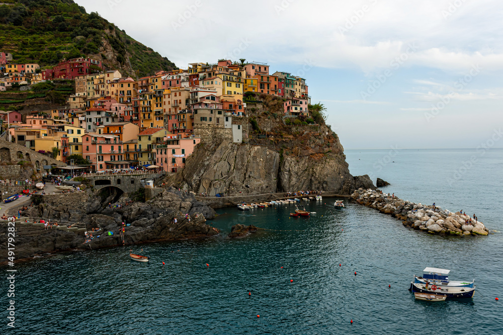 picturesque village of Manarola with colourful houses at the edge of the cliff Riomaggiore