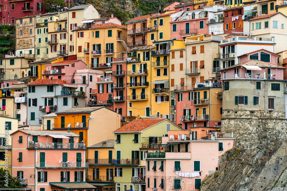colorful house, buildings and old facade with windows in small picturesque village Manarola Cinque terre in liguria