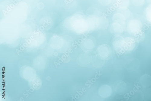 Abstract blurry blue color for background, Blur festival lights outdoor celebration and blue bokeh focus decorative. © Phokin
