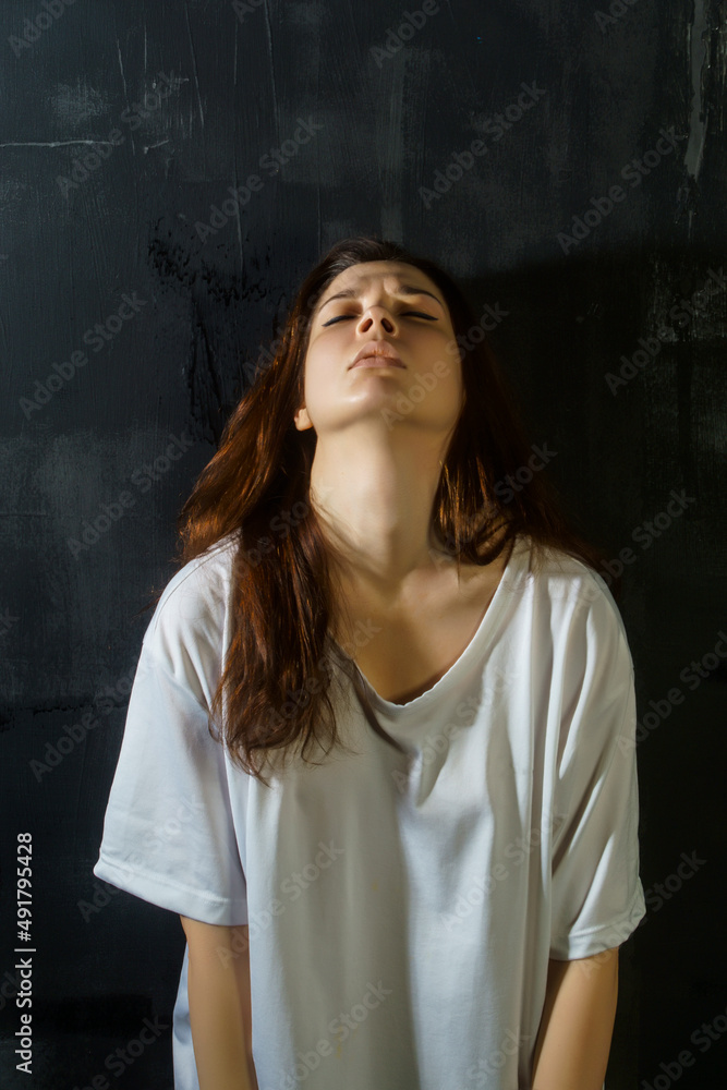portrait of a young woman in an emotional state of depression, stress, sadness, longing, loneliness, suffering portrait of a young woman in an emotional state of depression, stress, sadness, longing, loneliness, suffering