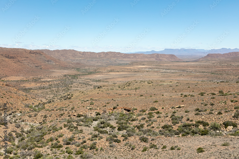 Scene of a valley and mountains in the arid Karoo National Park, South Africa