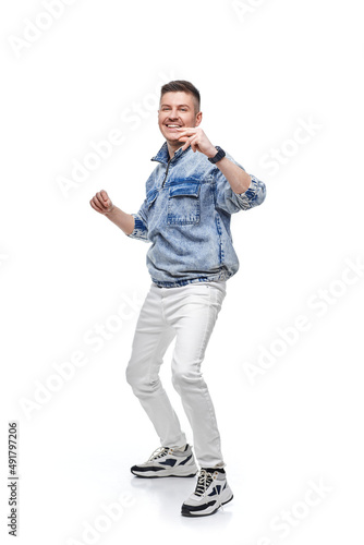 handsome young man in denim jacket with fist up