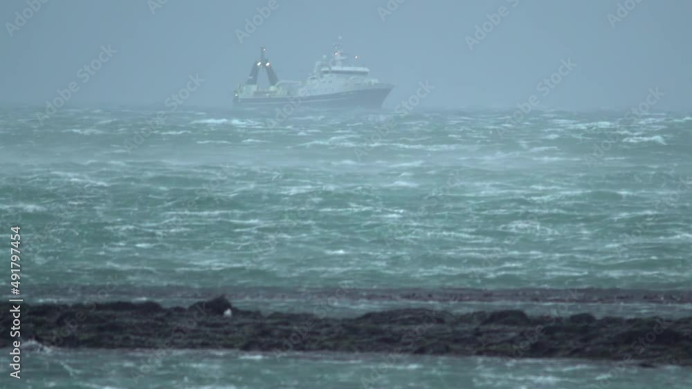 Icelandic fishing trawler in storm close to reef Icelandic fishing trawler in storm close to reef