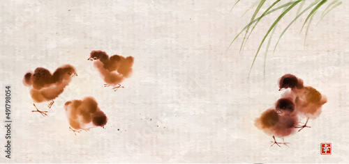 Little chick birds playing in green grass. Traditional oriental ink painting sumi-e, u-sin, go-hua. Hieroglyph - happiness.