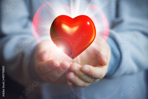 Hands holding red heart  The concept of love  friendship and peace. The concept of health  the fight against coronavirus  the fight against heart problems. organ donation