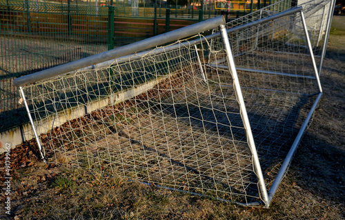 Proper storage of football gates on training football field. a series of injuries when a large structure of a football gate fell on a child and killed him. gates must lie on the ground after match