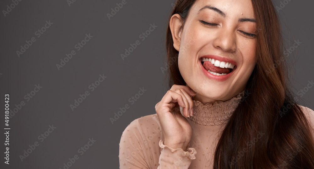 True beauty comes from being yourself. Cropped shot of an attractive young woman making a face in studio against a grey background. True beauty comes from being yourself. Cropped shot of an attractive young woman making a face in studio against a grey background.