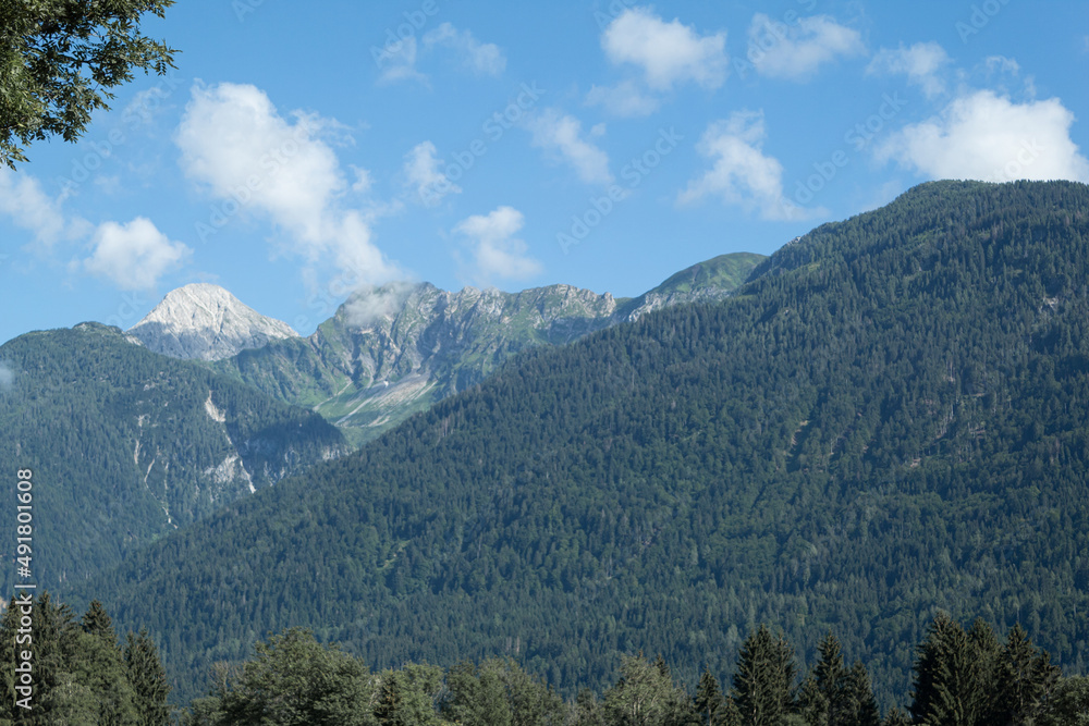 Cascade of beautiful mountains in the distance Cascade of beautiful mountains in the distance