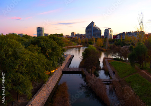 Turia river bed and gardens in the city park of the city of Valencia in Spain. View of the river from the bridge near the biopark. photo