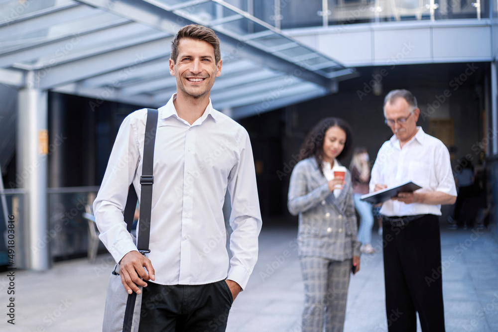 young entrepreneur standing in the hall of a business center. young entrepreneur standing in the hall of a business center.