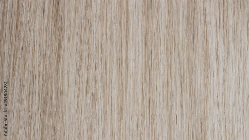 Light reflection passes through straight blonde hair | Shampoo commercial concept Light reflection passes through straight blonde hair | Shampoo commercial concept