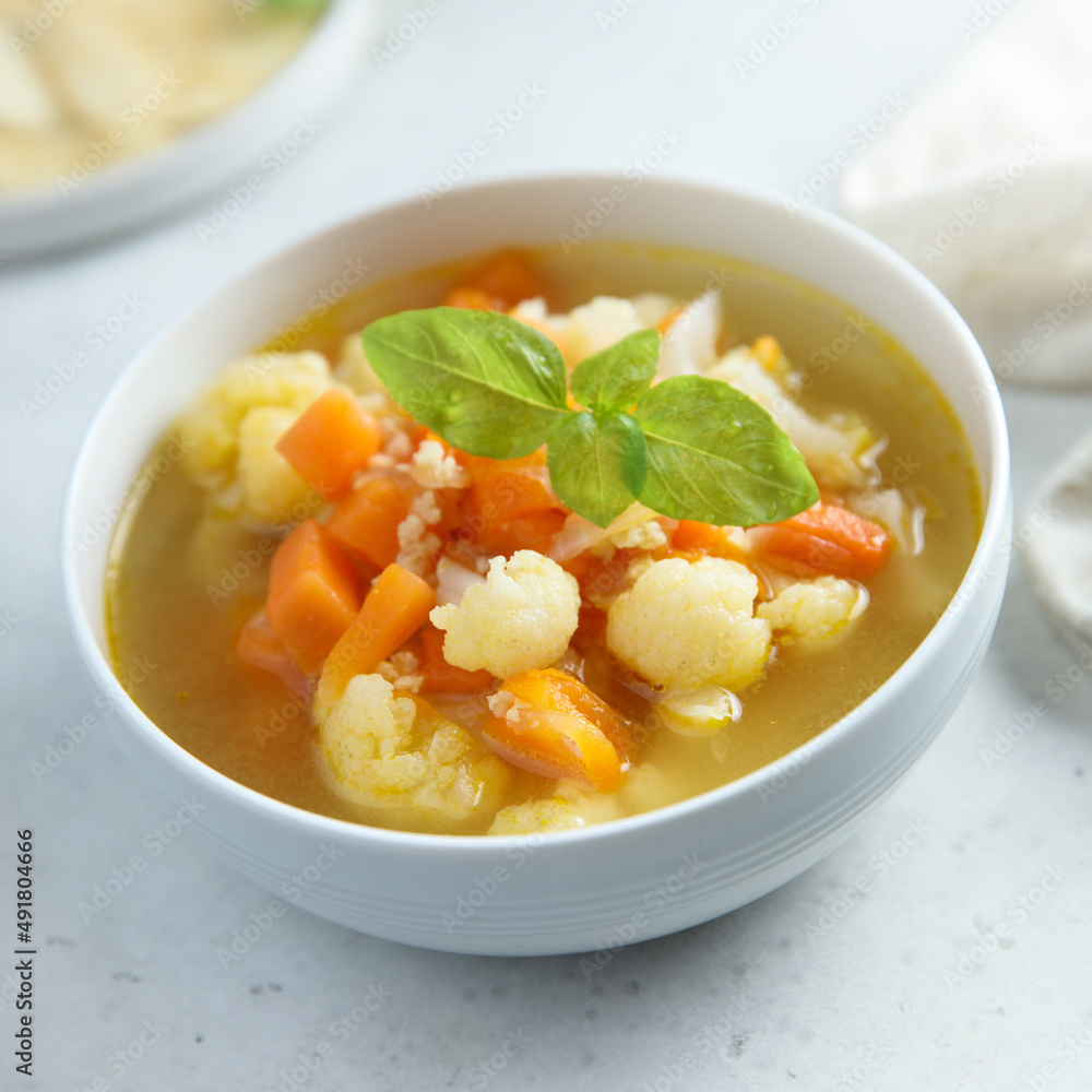 Homemade cauliflower soup with fresh basil Homemade cauliflower soup with fresh basil