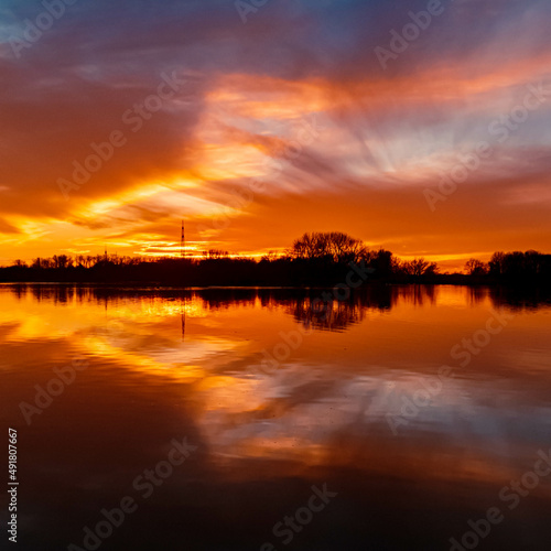 Beautiful sunset with reflections near Plattling, Isar, Bavaria, Germany