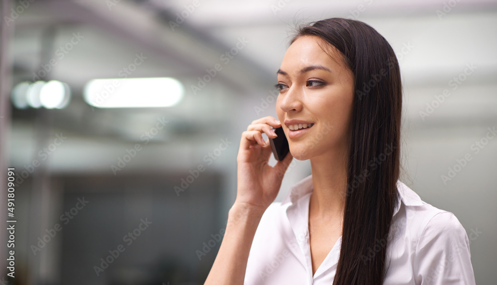 Sure, we can do that for you. Cropped shot of an attractive young woman using her cellphone in the office. Sure, we can do that for you. Cropped shot of an attractive young woman using her cellphone in the office.