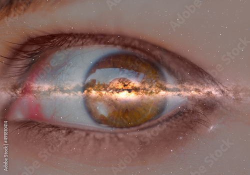 Fototapeta Milky Way galaxy in the beautiful girl eye with  frightened girl