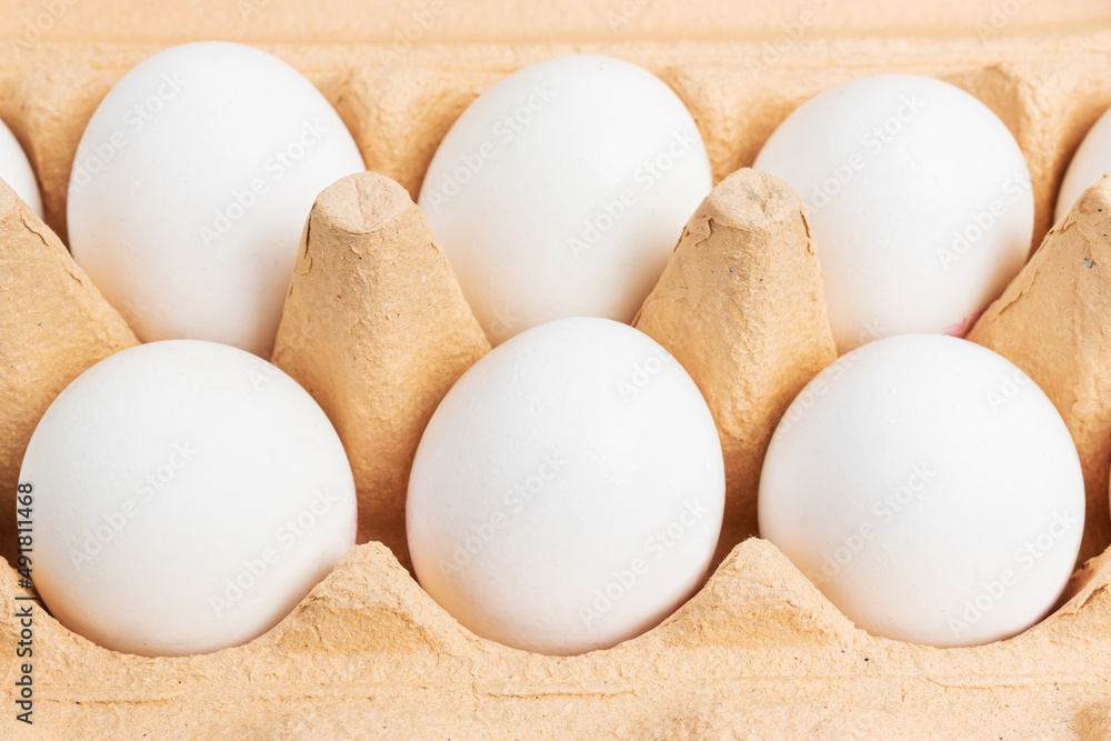 White chicken eggs in a carton box White chicken eggs in a carton box