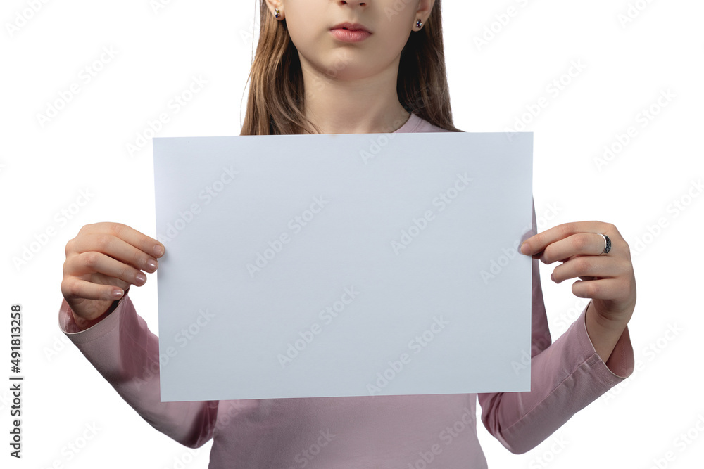 Little cute Ukrainian girl 11 years old posing in the studio on a white background. The child holds a blank white sheet in his hands. Preparation for the inscription. Little cute Ukrainian girl 11 years old posing in the studio on a white background. The child holds a blank white sheet in his hands. Preparation for the inscription.