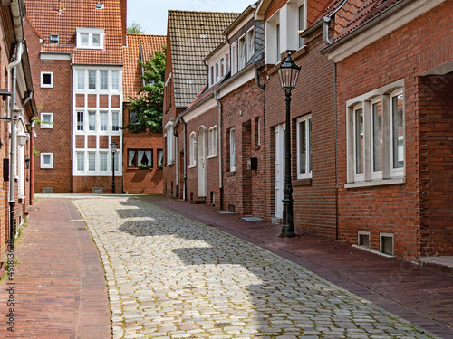 Straße mit Backsteinhäusern in der Altstadt der ostfriesischenStadt Emden, Deutschland photo