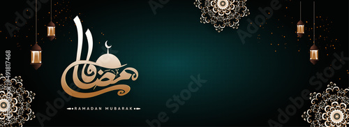 Brown Arabic Calligraphy Of Ramadan With Mosque  Hanging Lanterns And Top Mandala Pattern On Teal Light Effect Background.