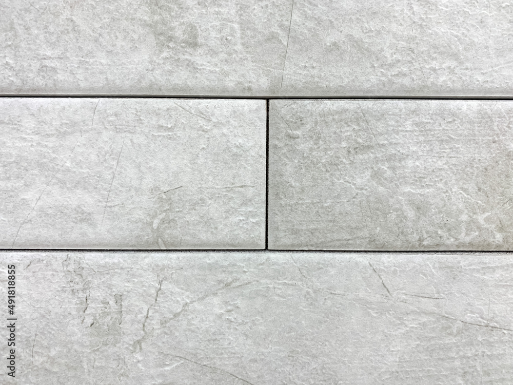 Naklejka premium Gray brick wall close-up and blur