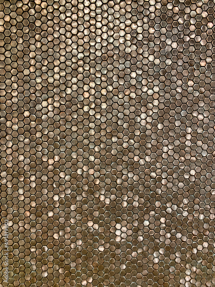 Fototapeta premium Bronze wall of small details close-up