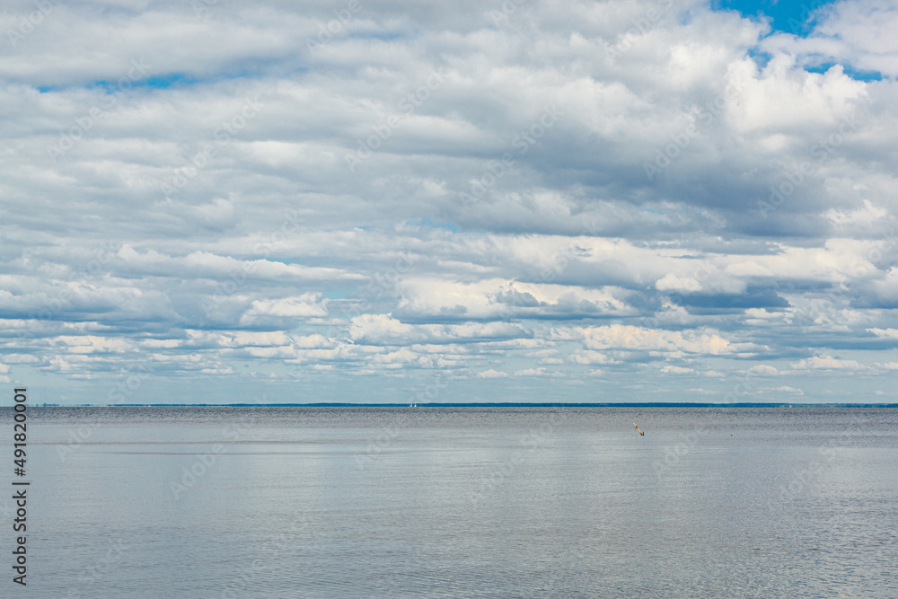 beautiful landscape of the sea against the background of a blue sky with clouds